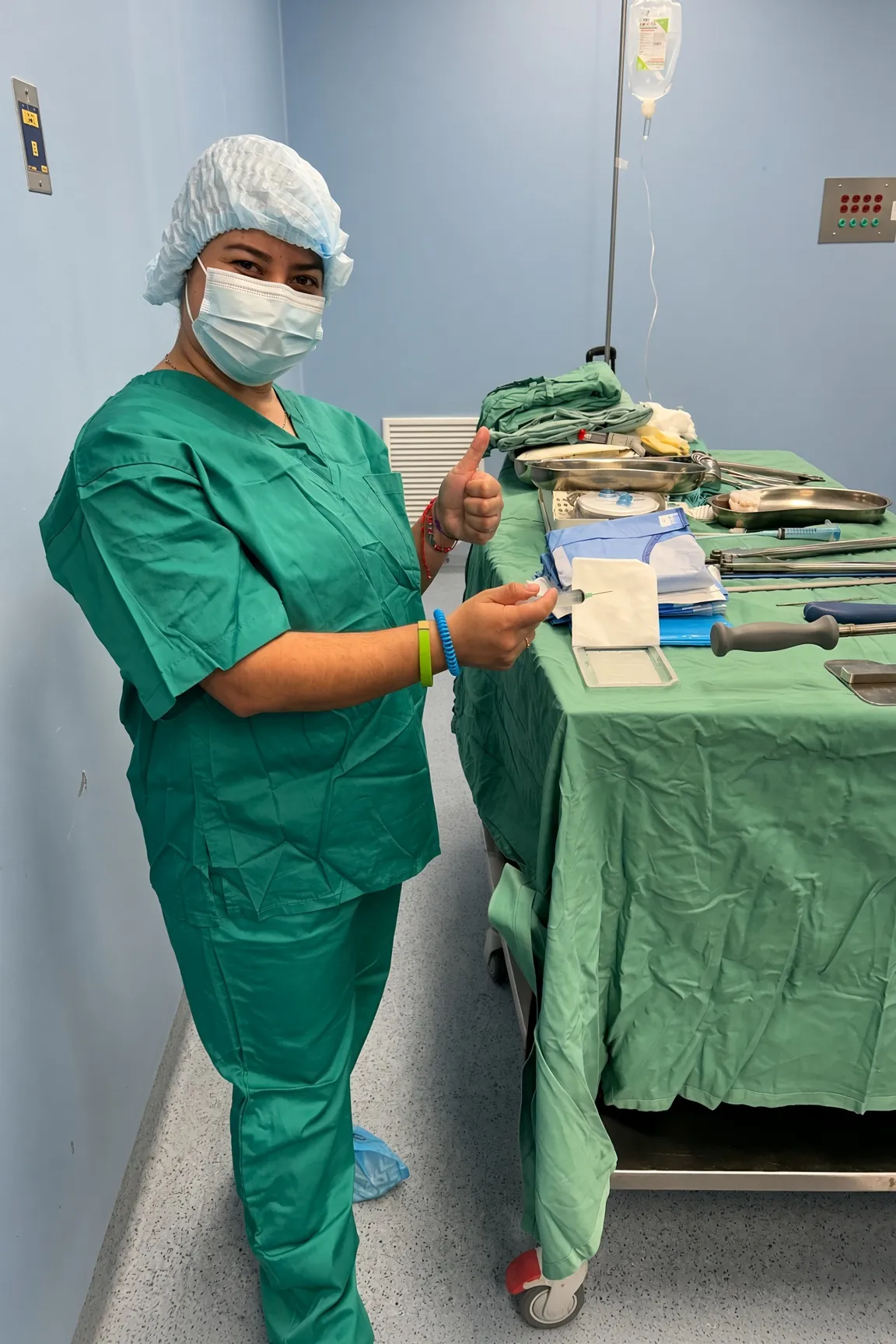 A SpineHope surgical nurse preparing instruments